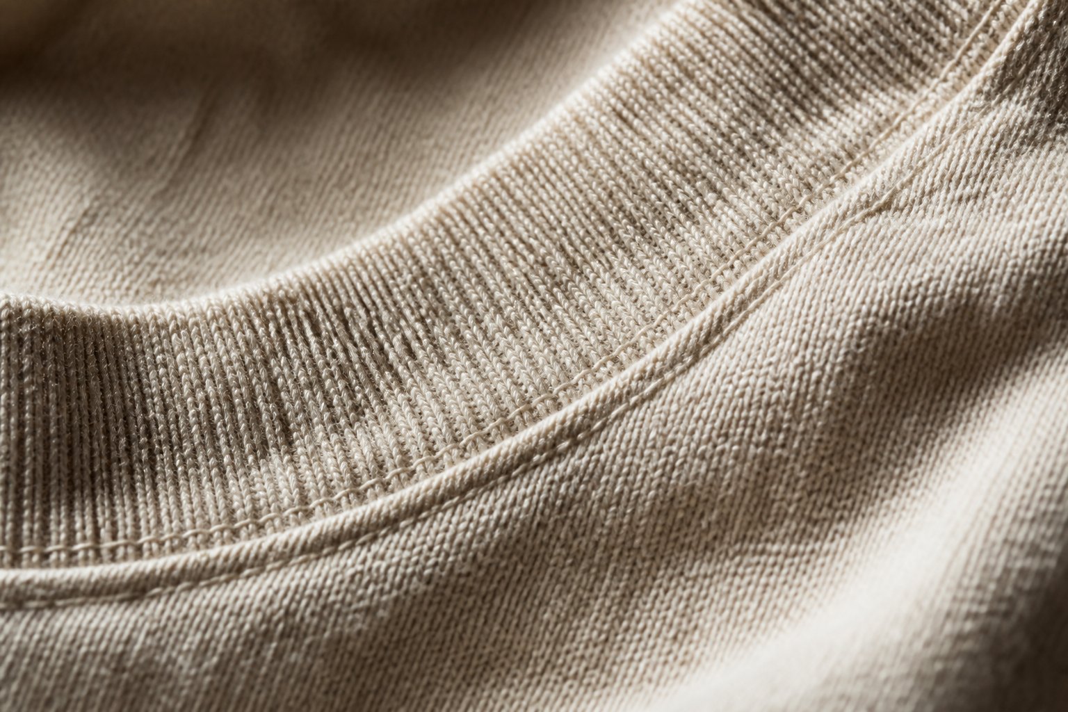 Macro detail of heavyweight cotton jersey and a ribbed collar seam