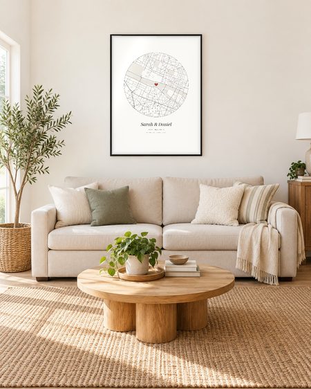 Circle map poster, black frame, above a sofa