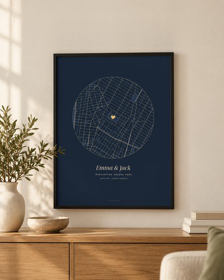 Navy circle map poster, black frame, on a wooden sideboard