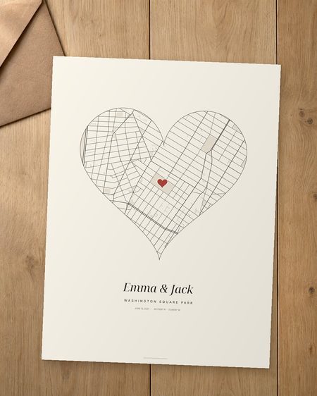 Heart map print on a wooden table next to a kraft envelope
