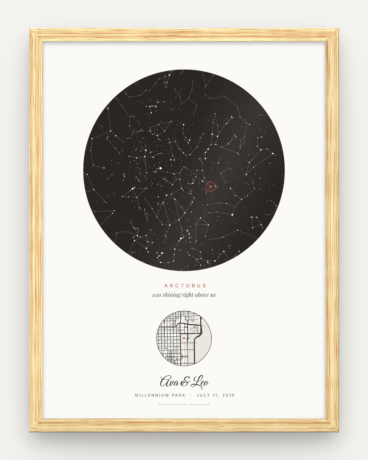 Close view of the framed Chicago poster on a plain light background: the round sky with Arcturus in red, the small street map with a heart, and the script names