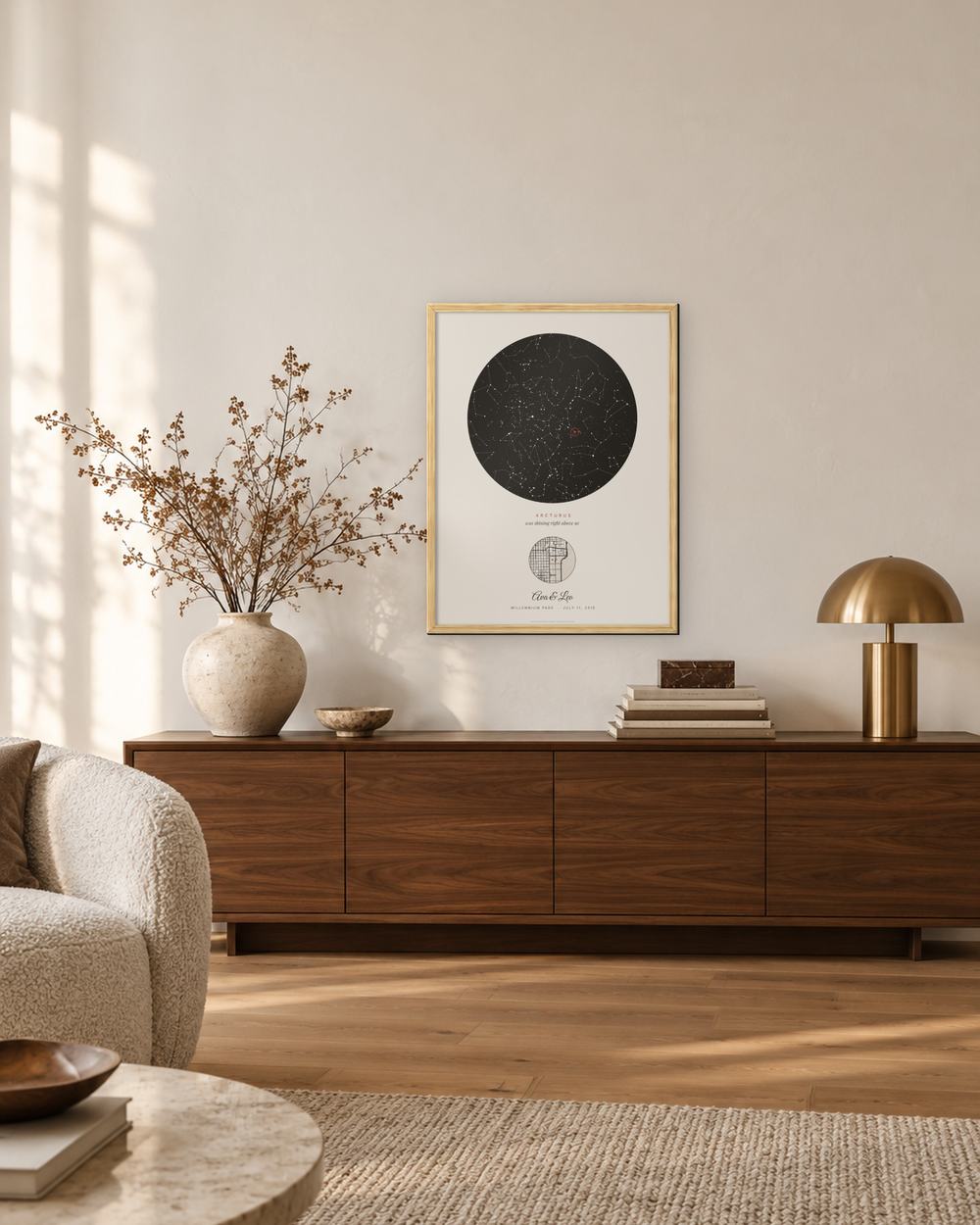 The same poster hung on a cream wall above a walnut sideboard next to a brass lamp, seen from across the living room