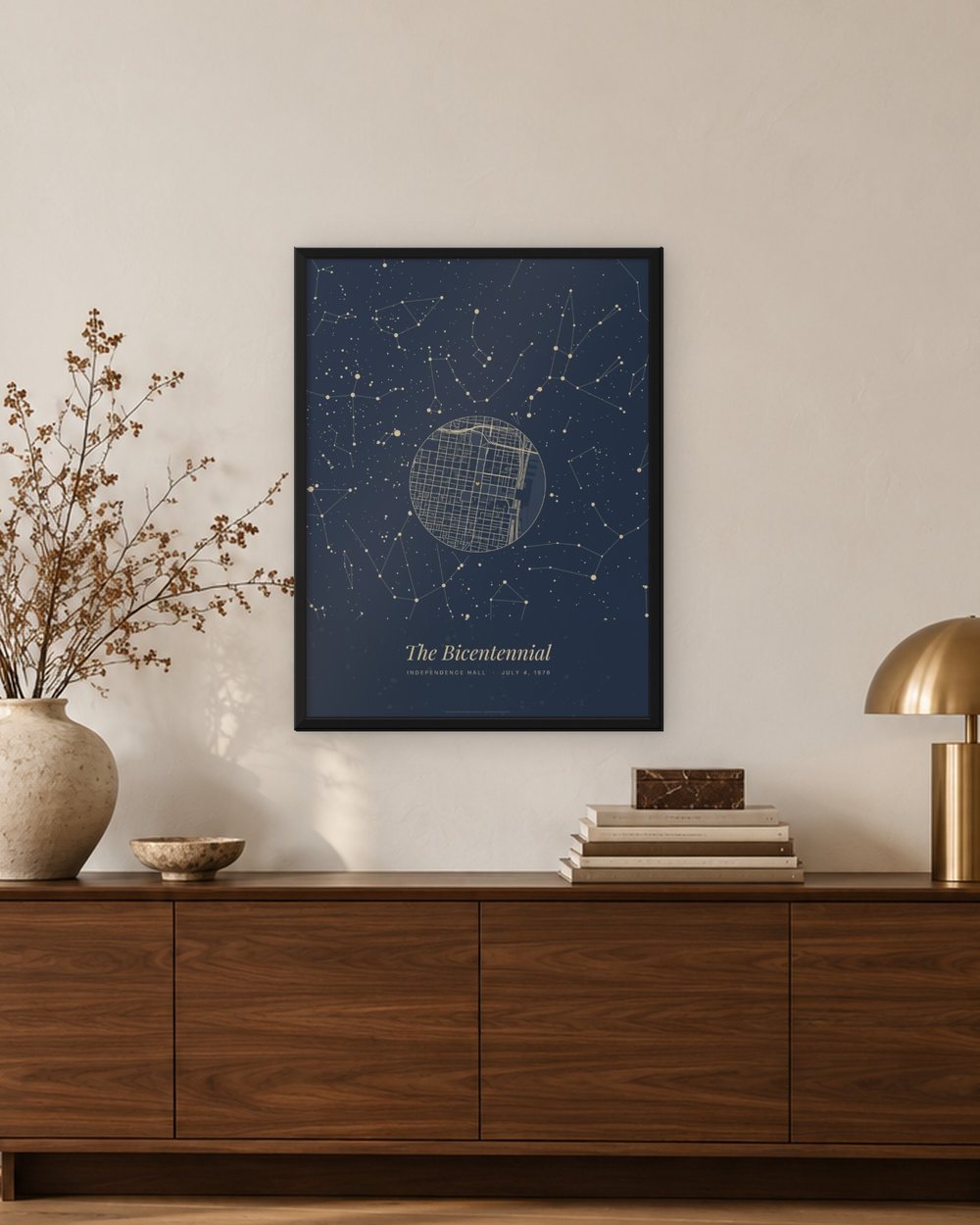 The same July 4, 1976 Philadelphia star map poster in a black frame hanging above a walnut sideboard