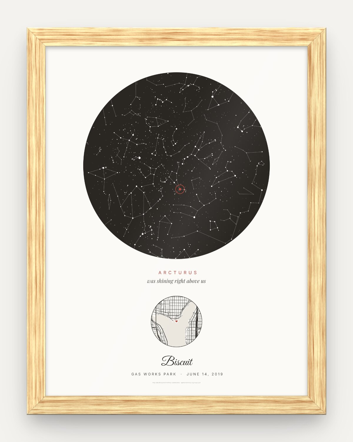 Pet memorial star map in an oak frame: black round night sky over Gas Works Park, Seattle, on June 14, 2019, with Arcturus circled in red, a small street map with a heart and the name Biscuit
